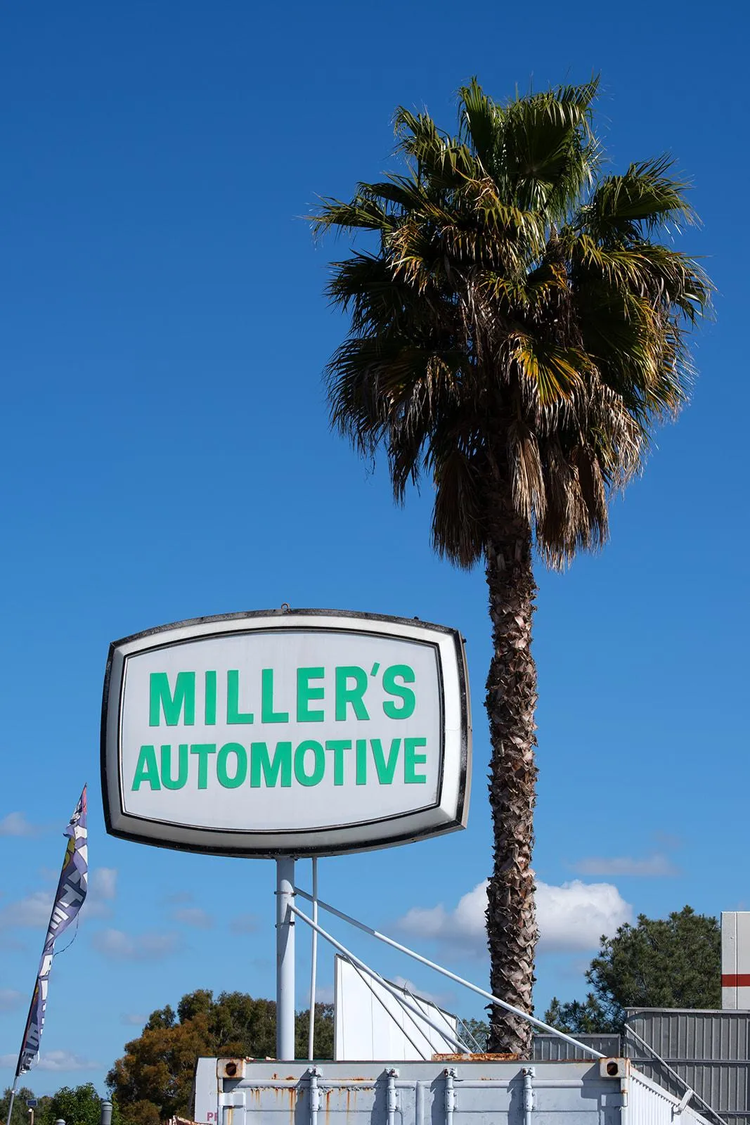The street sign for Miller's Automotive, a Fullerton auto repair shop
